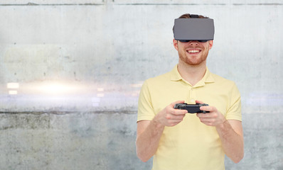 man in virtual reality headset and gamepad playing