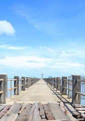 old wooden and concrete bridge to dock pier tranquil sea destination,Trang Thailand