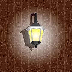 Wall light on the wooden wall. Isolated.