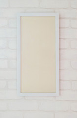 White frame for photo on brick wallpaper background