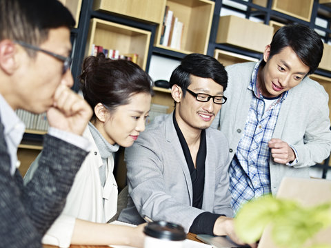 young asian business people working together in office