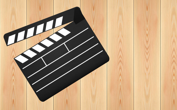 Movie clapperboard on wooden plank background