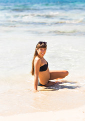 young beautiful  girl in swimsuit bikini posing on beach, fashion model, fitness figure.