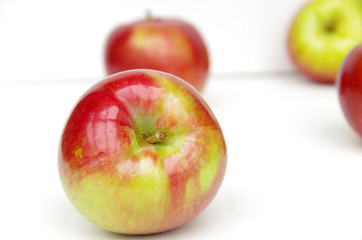 Red apples arranged in white background
