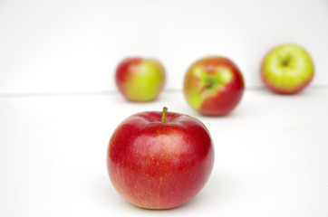 Red apples arranged in white background