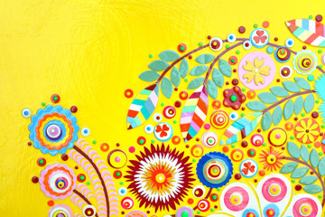 Fototapeta premium Flowers on yellow abstract surface, card or print poster composition made of paint layers, quelling with die cut and scissors, abstract background painting. 3d embossing and carving.