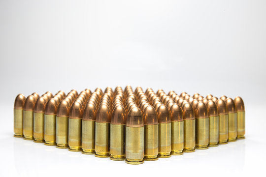 row of 9mm bullets isolated