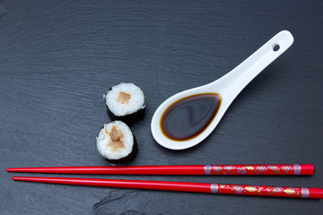 Maki with tuna on a slate top seen from above