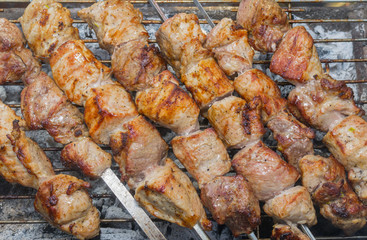 Shashlik - Georgian meal with meat cooked outdoor on smouldering carbons