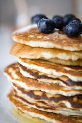 Pancakes with raspberries, blueberries and honey
