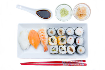 Tray of sushi on a white background seen from above