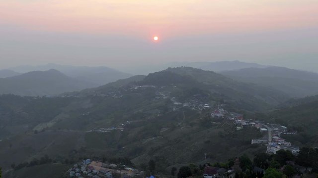 Beautiful shot sunrise at mountain village Northern ,Zoom out , Chiangrai ,Thailand 