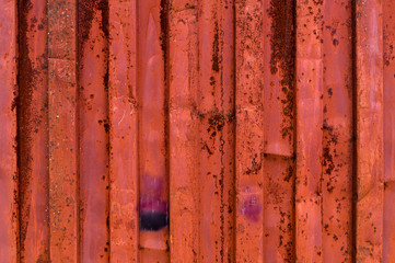 rough and rusty corrugated iron metal surface red close-up