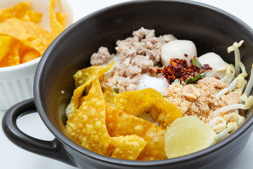 Spicy lemongrass flavored flat noodles with pork , Asian foods