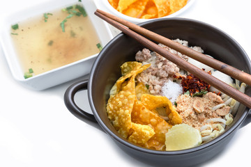 Spicy lemongrass flavored flat noodles with pork , Asian foods
