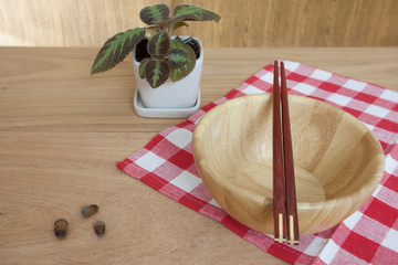 Empty bowl and chopsticks wooden on wood table background