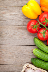 Fresh ripe vegetables on wooden table