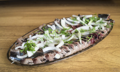Dish from salty fish with onion