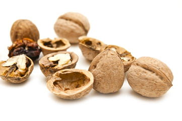 Some walnuts on a white background