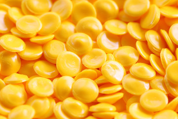 yellow plastic pellets background.