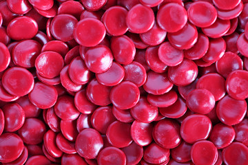 red plastic pellets background