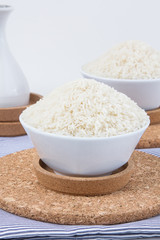 Glass bowl of rice on background,shallow Depth of Field,Focus on rice. 