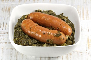 traditional German curly kale in ceramic bowl on wooden background