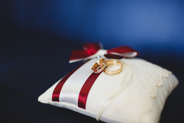 wedding rings on a cushion