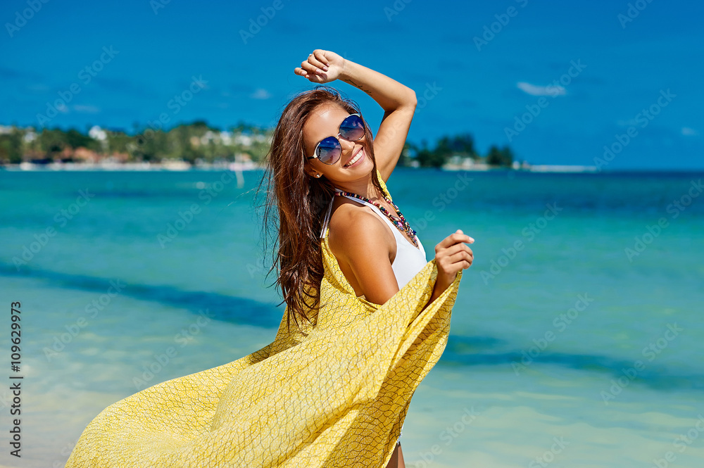 Wall mural beautiful pretty woman in bikini on tropical paradise beach