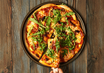Home made pizza on wooden table