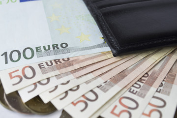 banknotes with a purse on a white background
