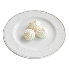 White meringue cake on white background