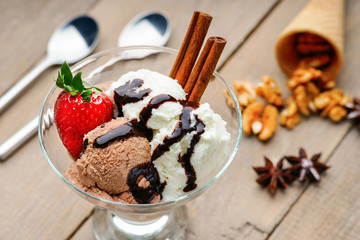 Ice cream sundae, waffle cone and spoons