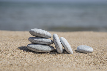 Fototapeta na wymiar pebble stones on sand