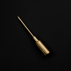 Golden mechanic handle screwdriver isolated on black background.