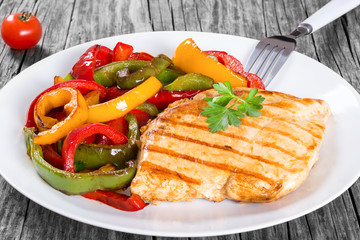 Grilled Chicken breast fillet and fried bell pepper , clos- up