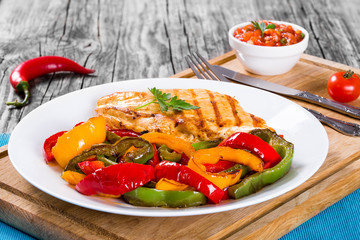 Grilled Chicken breast fillet and fried bell pepper , close-up