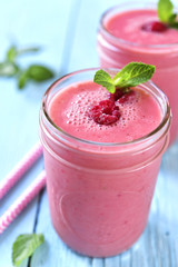 Berry smoothie in a mason jar.