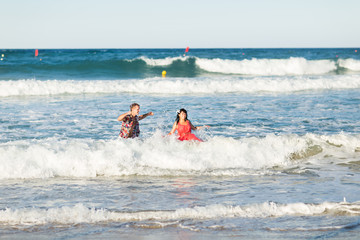 Romantic couple walking on the beach