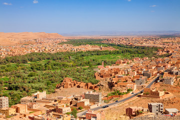 Fototapeta na wymiar Aerial view of Tinerhir city. Typical Moroccan town beside an oasis in Dades Valley