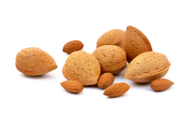 Heap of fresh almonds in shells isolated on white background