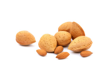 Heap of fresh almonds in shells isolated on white background