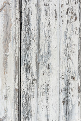 Weathered white wooden background with paint chipped and peeling.