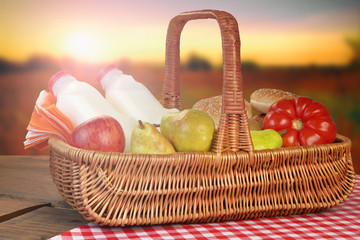 Picnic Basket With Food And Drink On The Table