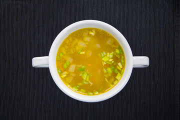 White cup with soup 