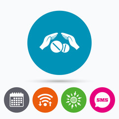 Medical insurance sign. Hand holds pills.