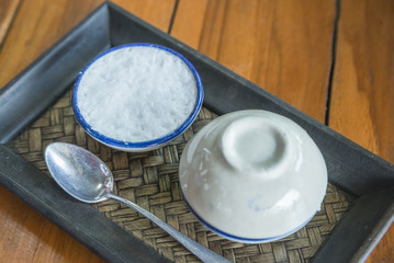 Thai desserts favorite Thailand delicious popular of process of making coconut milk custard in small porcelain cup.