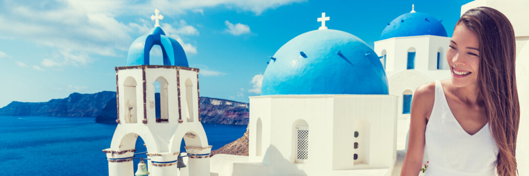 Fototapeta Europe tourist travel woman panorama banner from Oia, Santorini, Greece. Happy young woman looking at famous blue dome church landmark destination. Beautiful girl visiting the Greek islands.