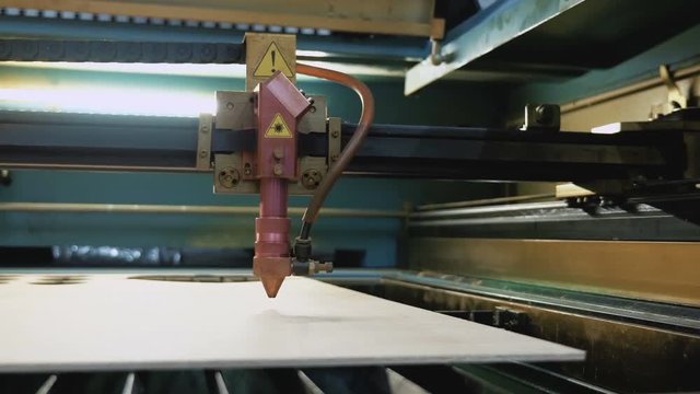 Laser cutting machine at work, pan