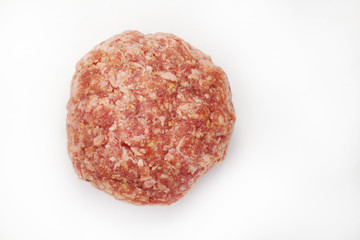 Raw beef burgers against white